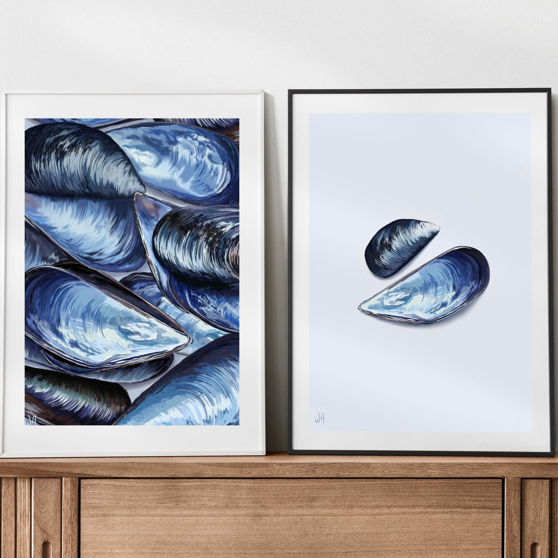 To frames resting on a sideboard, the left, a bright bed of mussels and the right, a 2 mussel print